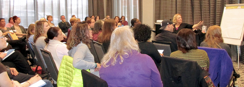 Katherine McLaughlin teaching a group of people about sexuality education for people with intellectual and developmental disabilities.