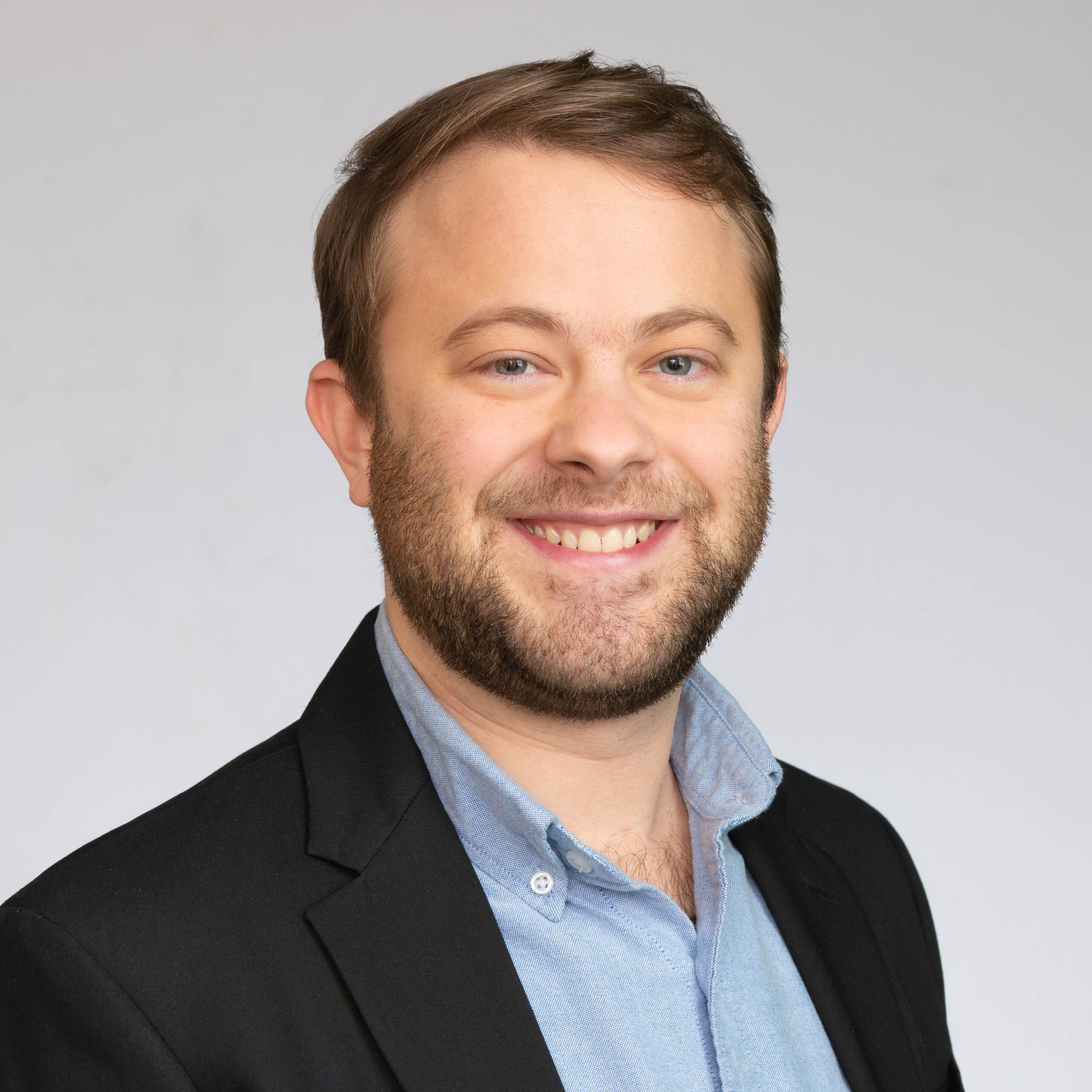 Headshot of Oscar Hughes.