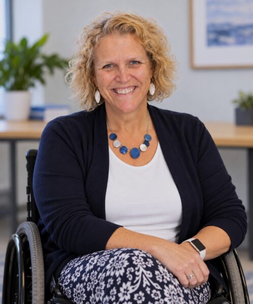 Katherine McLaughlin, M.Ed., an AASECT-Certified Sexuality Educator (CSE) seated with a smile.